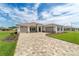 A beautiful single-Gathering home with a manicured lawn and a spacious three-car driveway at 10553 Sw 98Th Pl, Ocala, FL 34481