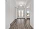 Bright foyer with decorative glass doors and wood-look flooring at 10553 Sw 98Th Pl, Ocala, FL 34481