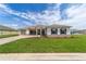 Traditional single-Gathering home with manicured lawn, gray trim, and welcoming two-car driveway at 10553 Sw 98Th Pl, Ocala, FL 34481