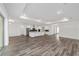 Open concept living with modern kitchen, wood floors, and ample natural light at 10553 Sw 98Th Pl, Ocala, FL 34481