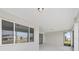 An outdoor patio has windows with views of the backyard and neighborhood at 10553 Sw 98Th Pl, Ocala, FL 34481