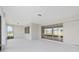 Covered patio area with a neutral floor and ceiling plus sliding glass doors at 10553 Sw 98Th Pl, Ocala, FL 34481