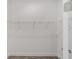 An empty walk-in closet with wire shelving and hardwood flooring awaits to be filled at 10553 Sw 98Th Pl, Ocala, FL 34481