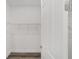 An empty walk-in closet with wire shelving and hardwood flooring awaits to be filled at 10553 Sw 98Th Pl, Ocala, FL 34481