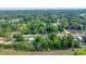 Expansive aerial view of a neighborhood surrounded by lush greenery and open fields at 1322 Ne 53Rd St, Ocala, FL 34479