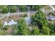 Bird's eye view shows a home, detached building, and surrounding greenery in a rural landscape at 1322 Ne 53Rd St, Ocala, FL 34479