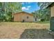 Back exterior view of a single-story home on a well-maintained lot at 1322 Ne 53Rd St, Ocala, FL 34479