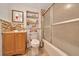 Well-lit bathroom featuring a shower and vanity at 1322 Ne 53Rd St, Ocala, FL 34479
