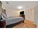 Comfortable bedroom with laminate floors, a large bed, and closet with ample storage space at 1322 Ne 53Rd St, Ocala, FL 34479