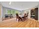 Inviting dining room with large windows, hardwood floors, and a view of the backyard at 1322 Ne 53Rd St, Ocala, FL 34479
