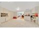 Spacious kitchen area featuring tile floors, white cabinets, and a view into the dining room at 1322 Ne 53Rd St, Ocala, FL 34479