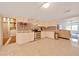 Well-lit kitchen with white cabinetry, stainless steel appliances, and tile flooring at 1322 Ne 53Rd St, Ocala, FL 34479