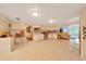 Large kitchen area with white cabinets and tile flooring, flowing to other spaces at 1322 Ne 53Rd St, Ocala, FL 34479