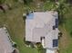 Bird's eye view of the home with solar panels and a sunroom, highlighting energy efficiency at 13863 Se 85Th Cir, Summerfield, FL 34491