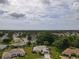 Sprawling neighborhood with lush greenery and tree canopies offering a serene and picturesque setting at 13863 Se 85Th Cir, Summerfield, FL 34491