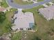 Aerial view of a home featuring solar panels, surrounded by well-maintained landscaping and neighborhood charm at 13863 Se 85Th Cir, Summerfield, FL 34491