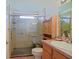Updated bathroom featuring a spacious shower with glass doors and a built-in seat at 13863 Se 85Th Cir, Summerfield, FL 34491