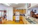 Bright kitchen with wood cabinets, stainless sink and appliances and hardwood floor at 13863 Se 85Th Cir, Summerfield, FL 34491