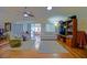 Bright living area with hardwood floors, comfortable seating, and a seamless flow into the adjacent spaces at 13863 Se 85Th Cir, Summerfield, FL 34491