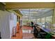 Spacious sunroom with tile flooring, many windows, and a clear glass skylight at 13863 Se 85Th Cir, Summerfield, FL 34491