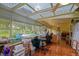 Sunroom with tile floors, large windows, and a clear glass skylight at 13863 Se 85Th Cir, Summerfield, FL 34491