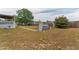 Spacious backyard with above ground pool, patio, mature tree, and shed at 14276 Se 61St Ave, Summerfield, FL 34491
