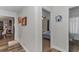 Hallway leading to the bedroom, showcasing the home's seamless layout and design at 14276 Se 61St Ave, Summerfield, FL 34491