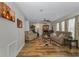 Spacious living room boasts a fireplace, ceiling fan, and lots of natural light at 14276 Se 61St Ave, Summerfield, FL 34491