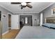 A spacious main bedroom with gray walls, carpet floors, and an ensuite bathroom at 14276 Se 61St Ave, Summerfield, FL 34491
