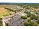 Aerial view of a Primary-planned community showcasing pool, clubhouse, tennis and other recreation facilities at 1429 Sw 160Th Ln, Ocala, FL 34473