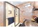 Bathroom featuring a walk-in shower with glass doors, vessel sink, and textured walls at 1429 Sw 160Th Ln, Ocala, FL 34473