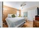 Cozy bedroom featuring a queen bed, ceiling fan, and comfortable furnishings at 1429 Sw 160Th Ln, Ocala, FL 34473