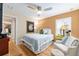 Comfortable bedroom with a cozy armchair and stylish decor at 1429 Sw 160Th Ln, Ocala, FL 34473