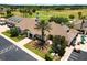 Stunning golf clubhouse with lush landscaping, palm trees, and expansive green golf course views at 1429 Sw 160Th Ln, Ocala, FL 34473
