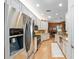 Bright kitchen featuring stainless steel appliances, granite countertops, and white cabinetry at 1429 Sw 160Th Ln, Ocala, FL 34473