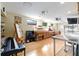Spacious living room with a piano, desk, and views of the pool at 1429 Sw 160Th Ln, Ocala, FL 34473