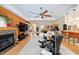 Living space with a fireplace and open layout with view to the dining area at 1429 Sw 160Th Ln, Ocala, FL 34473
