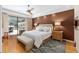 Comfortable main bedroom with large sliding door to the lanai, and neutral decor at 1429 Sw 160Th Ln, Ocala, FL 34473