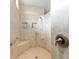Modern tiled shower with built-in seat and niches for toiletries, plus hand rails at 1429 Sw 160Th Ln, Ocala, FL 34473