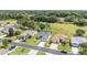 Aerial view of multiple homes with well-manicured lawns with lush greenery at 15119 Sw 14Th Avenue Rd, Ocala, FL 34473