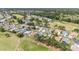 Beautiful aerial view of the neighborhood with golf course and lush greenery at 15119 Sw 14Th Avenue Rd, Ocala, FL 34473