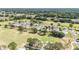 Beautiful aerial view of the neighborhood with golf course and lush greenery at 15119 Sw 14Th Avenue Rd, Ocala, FL 34473