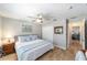 Comfortable bedroom featuring wood-look floors, a ceiling fan, and a closet for storage at 15119 Sw 14Th Avenue Rd, Ocala, FL 34473