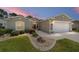 Charming single-story home with a well-manicured lawn and inviting entrance at 15119 Sw 14Th Avenue Rd, Ocala, FL 34473