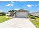 Charming home with a well-manicured lawn, inviting curb appeal, and a spacious driveway at 15119 Sw 14Th Avenue Rd, Ocala, FL 34473