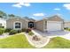 Charming single-story home with well-manicured lawn and attached garage at 15119 Sw 14Th Avenue Rd, Ocala, FL 34473