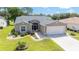 Charming single-story home with well-manicured lawn and attached garage at 15119 Sw 14Th Avenue Rd, Ocala, FL 34473