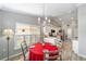Eat-in kitchen featuring white cabinetry, stainless steel appliances, and a cozy dining area at 15119 Sw 14Th Avenue Rd, Ocala, FL 34473