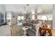 Spacious living room with sliding glass doors and open to the kitchen, offering a seamless flow at 15119 Sw 14Th Avenue Rd, Ocala, FL 34473