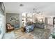 Spacious living room with wood floors, ceiling fan, and open floor plan at 15119 Sw 14Th Avenue Rd, Ocala, FL 34473